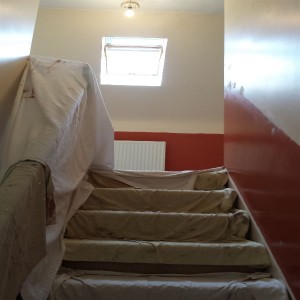 Getting the walls ready for painting.