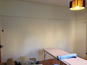 Preparing the walls for wallpapering.