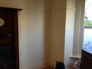 Preparing the walls for wallpapering.