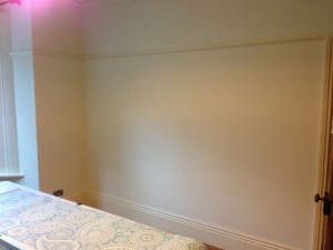 Preparing the walls for wallpapering.