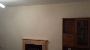 Preparing the wall for wallpapering.