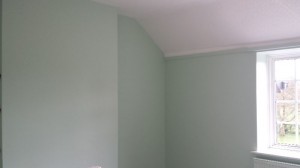 Bedroom walls after applying 2 coats of paint.