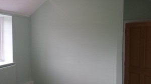 Bedroom walls after applying 2 coats of paint.
