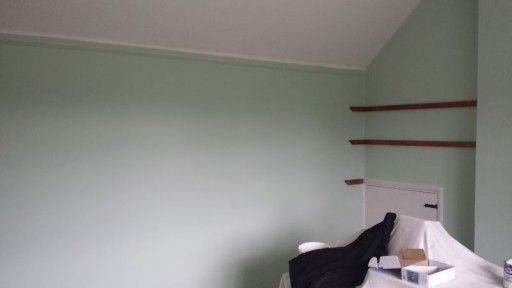 Bedroom walls after applying 2 coats of paint.