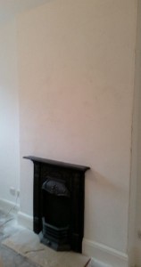Preparing a wall ready for wallpaper.