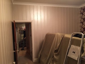 Living room walls before applying wallpaper.