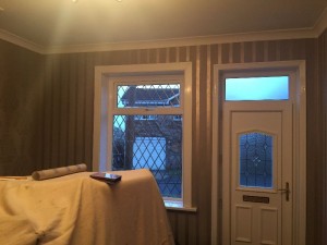 Living room walls after applying wallpaper.