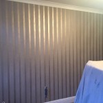 Living room walls after applying wallpaper.
