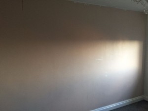 Before wallpapering the wall.