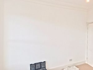 Prior to wallpapering.