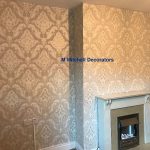 Living room feature wall after applying wallpaper.