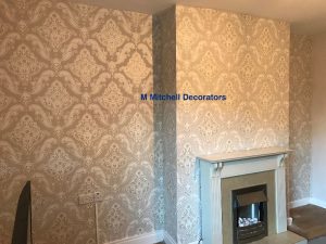 Living room feature wall after applying wallpaper.
