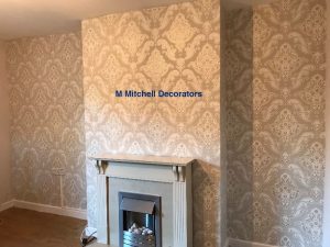 Living room feature wall after applying wallpaper.