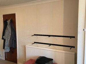 Bedroom after applying wallpaper.
