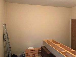 Preparing the walls for painting.