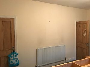 Preparing the wall for Wallpapering.