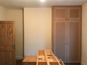 Preparing the walls for painting.