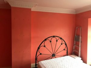 Preparing the bedroom for painting.