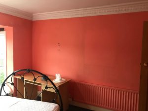 Preparing the bedroom for painting.