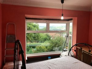 Preparing the bedroom for painting.