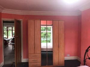 Preparing the bedroom for painting.
